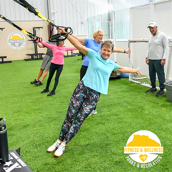 Golf Conditioning class with 4 people on the TRX straps in the Functional Fitness area of the MAC
